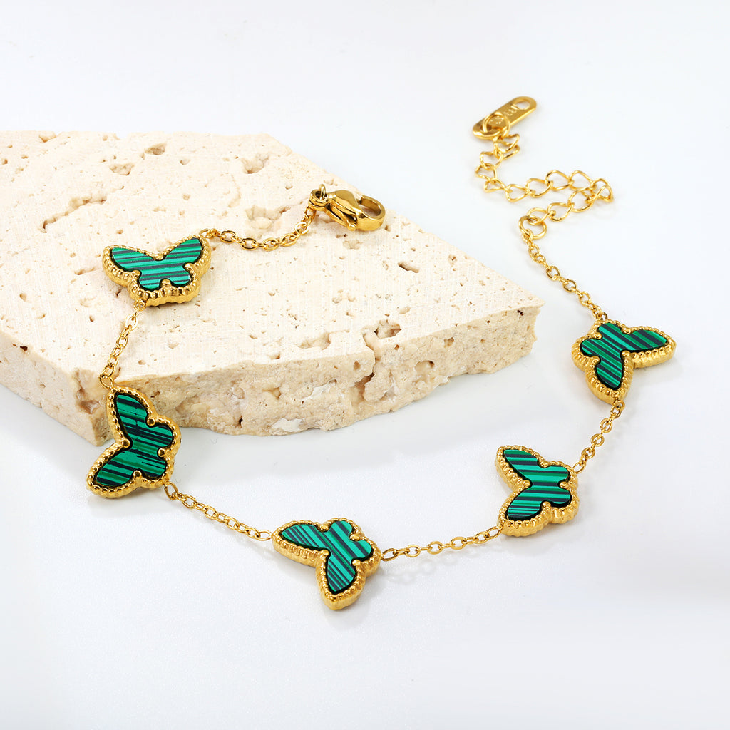 Damen Armband mit bunten Schmetterlingsanhängern und hochwertiger Goldbeschichtung Shop Nory
