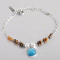Damen Armband mit einzigartigem Edelsteinanhänger und eleganter Perlenverzierung Shop Nory