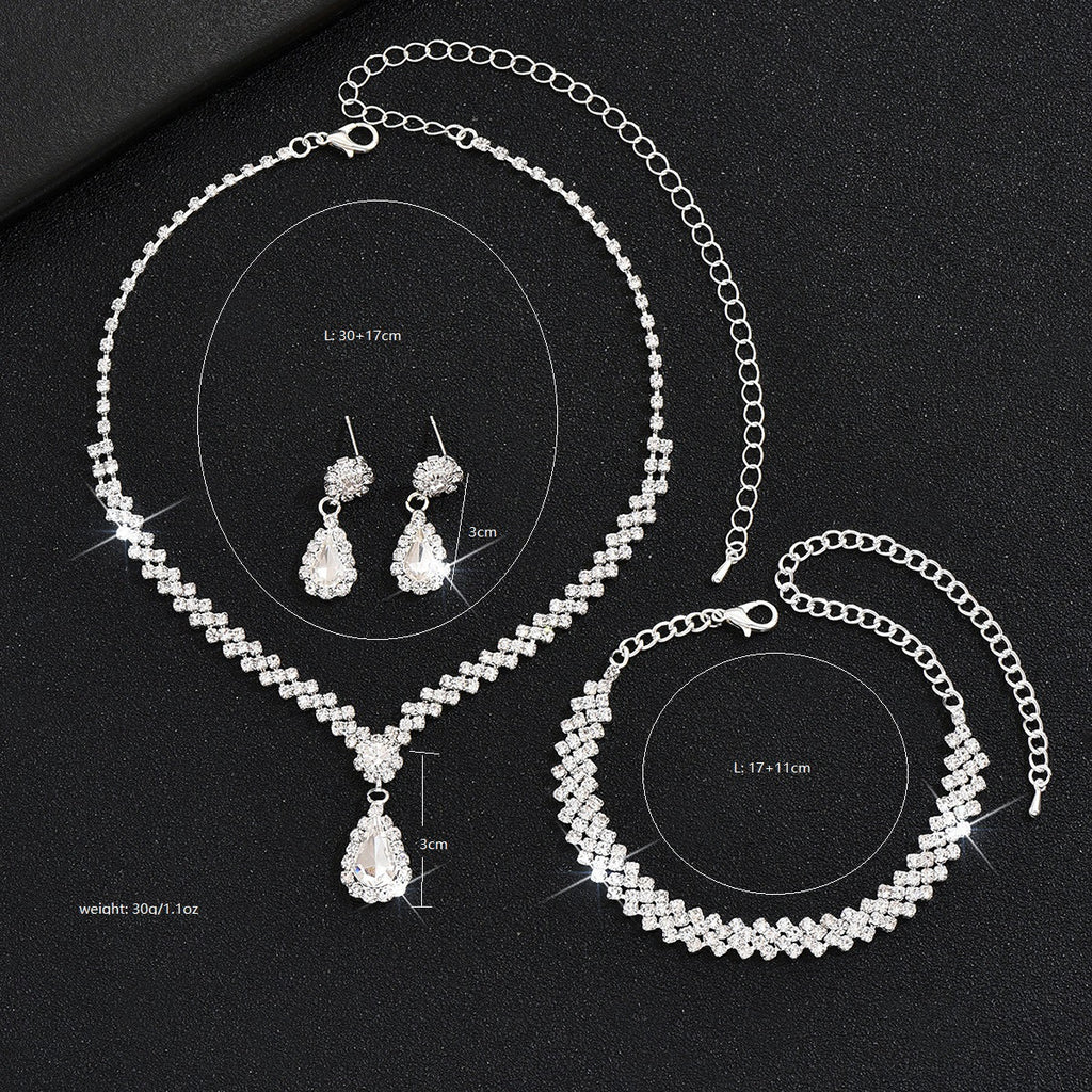 Tropfenpendant und passendes Tropfohrschmuckset für Braut mit kubischem Zirkonia-Halo