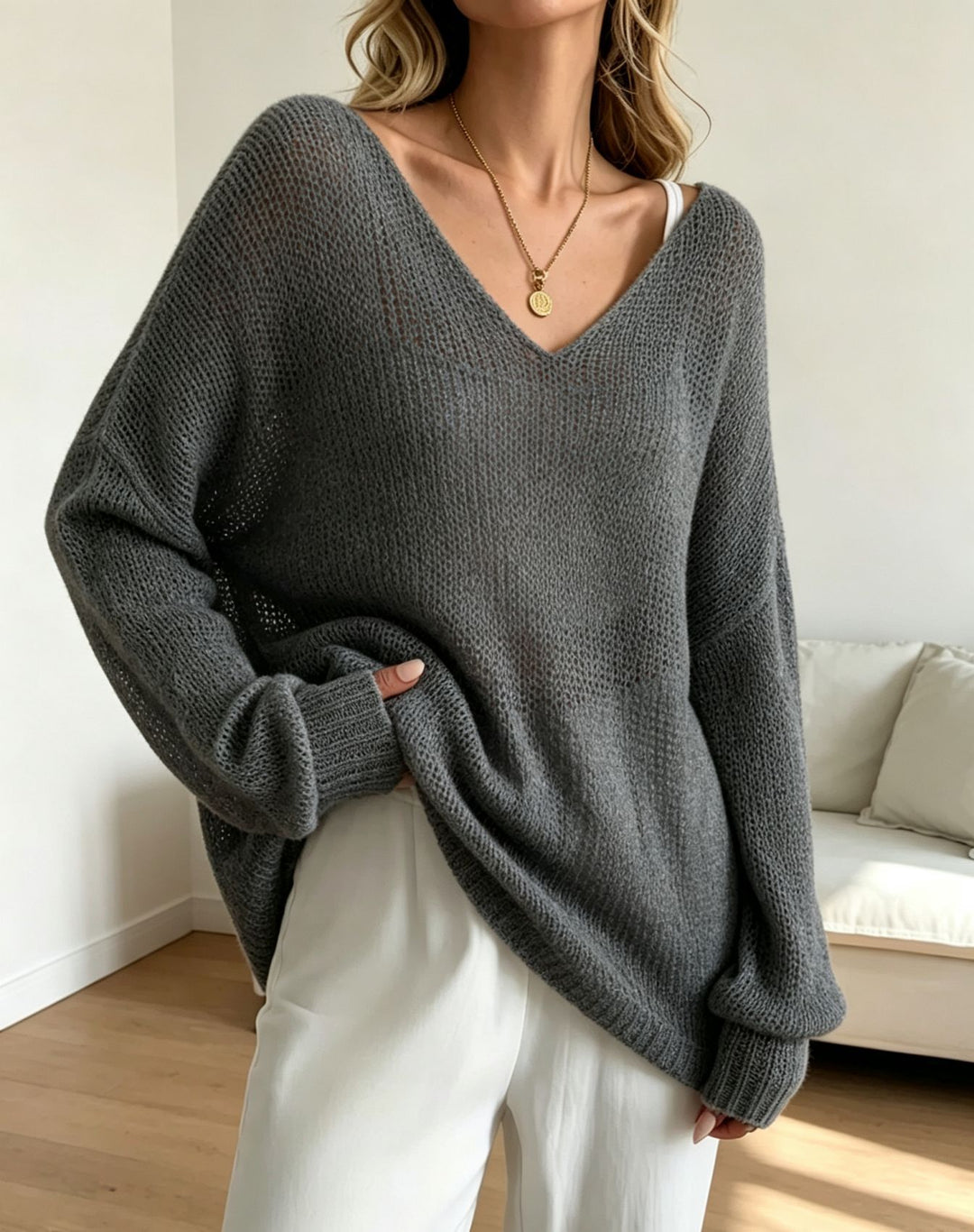Damen Oversized Strickpullover mit tiefem V-Ausschnitt und feiner Lochstrickstruktur Shop Nory