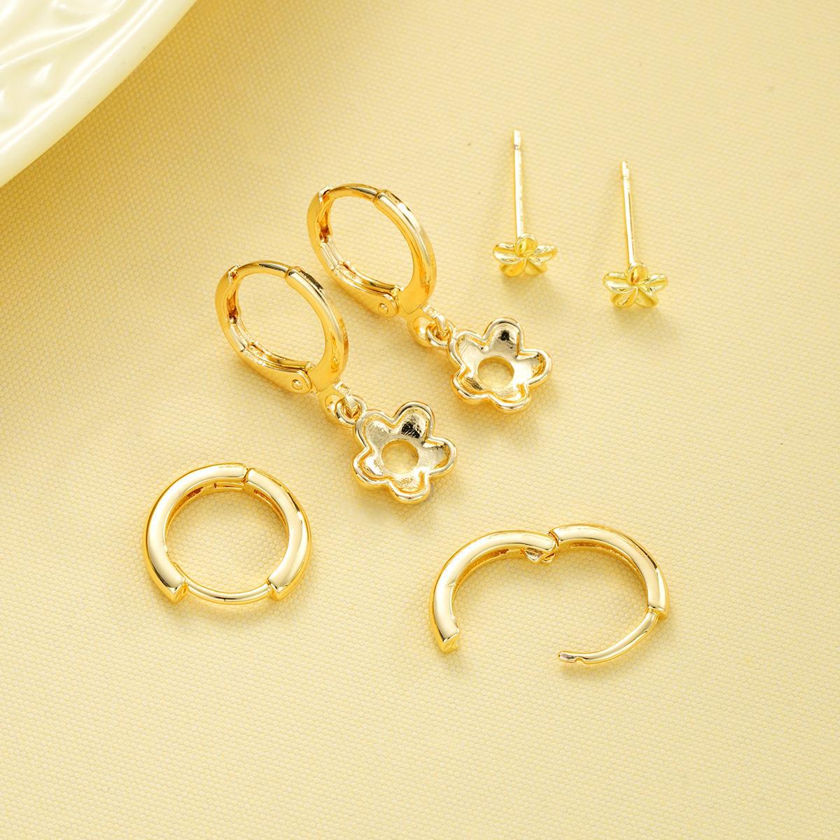 Damenohrringe mit floralen Anhängern und funkelnden Details Shop Nory