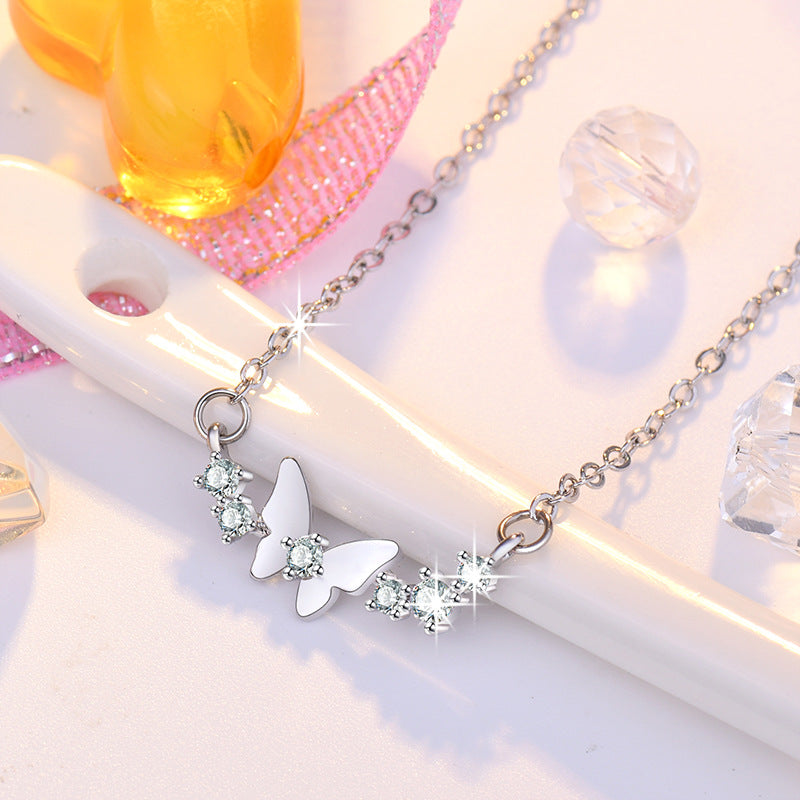 Damen Halskette mit filigranem Schmetterlingsdesign und funkelnden Zirkonia Shop Nory