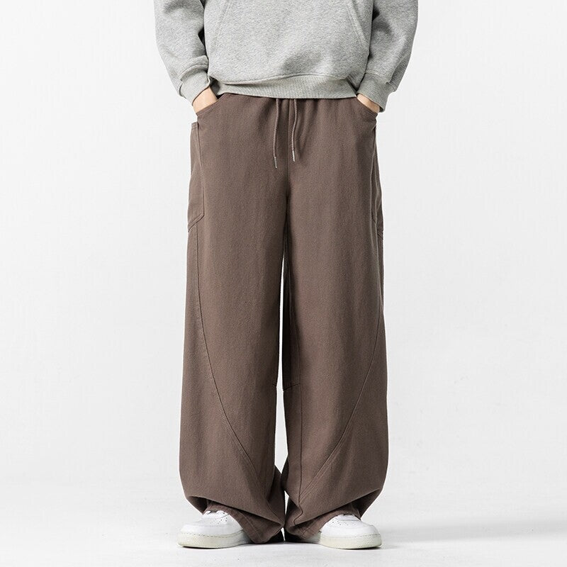 Herren Weite Loungehose mit Tunnelzug, aufgesetzten Taschen und markanten Panelnähten Shop Nory
