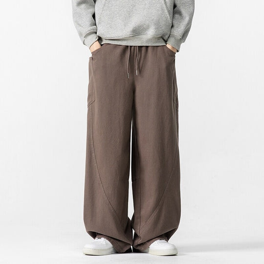 Herren Weite Loungehose mit Tunnelzug, aufgesetzten Taschen und markanten Panelnähten Shop Nory