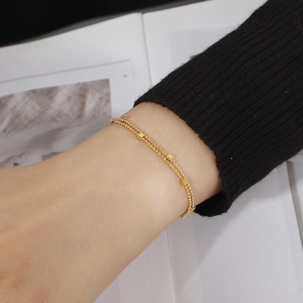 Damen zierliches Armband mit doppelter Kettenanordnung und funkelnden Akzenten Shop Nory