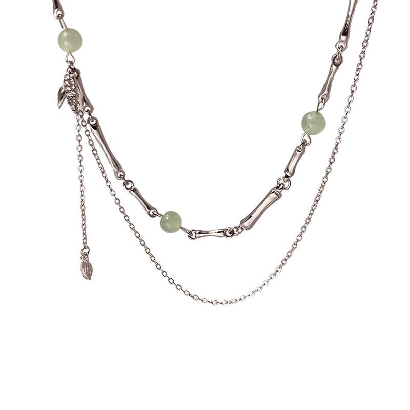 Damen Halskette mit filigranen Gliederketten und eleganten Edelsteinanhängern Shop Nory