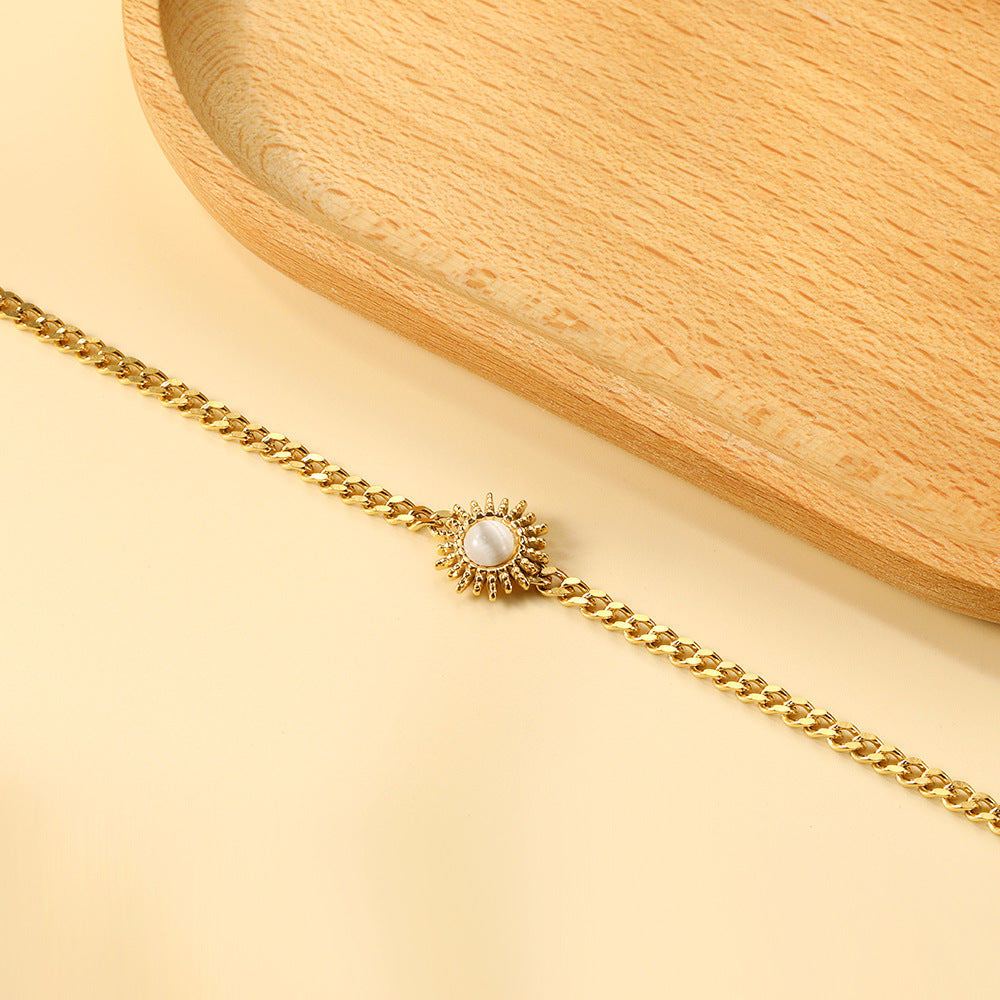 Damen Edelstahl Armkettchen mit goldplattiertem Sonnenanhänger Shop Nory