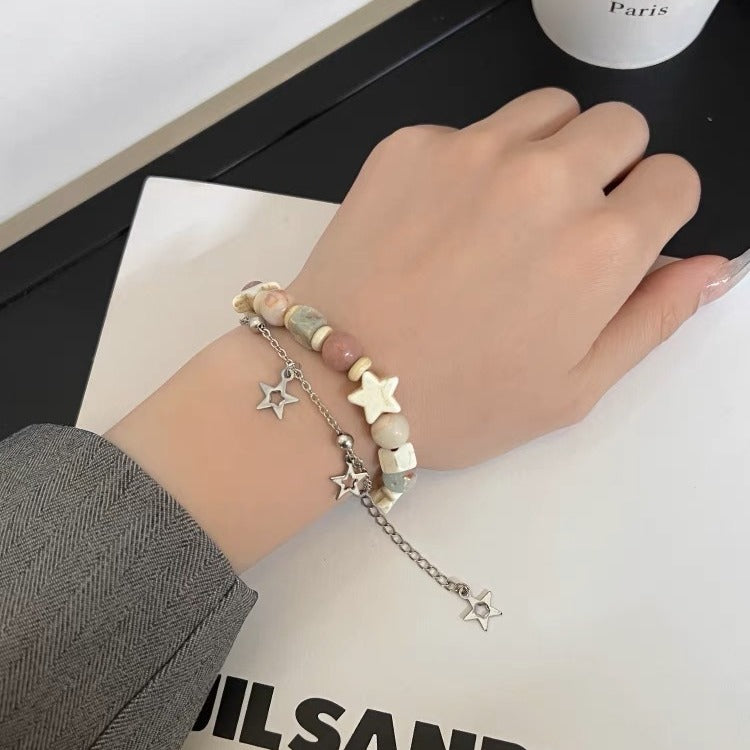 Damen Armband mit bunten Halbedelsteinen und funkelndem Sternenanhänger Shop Nory
