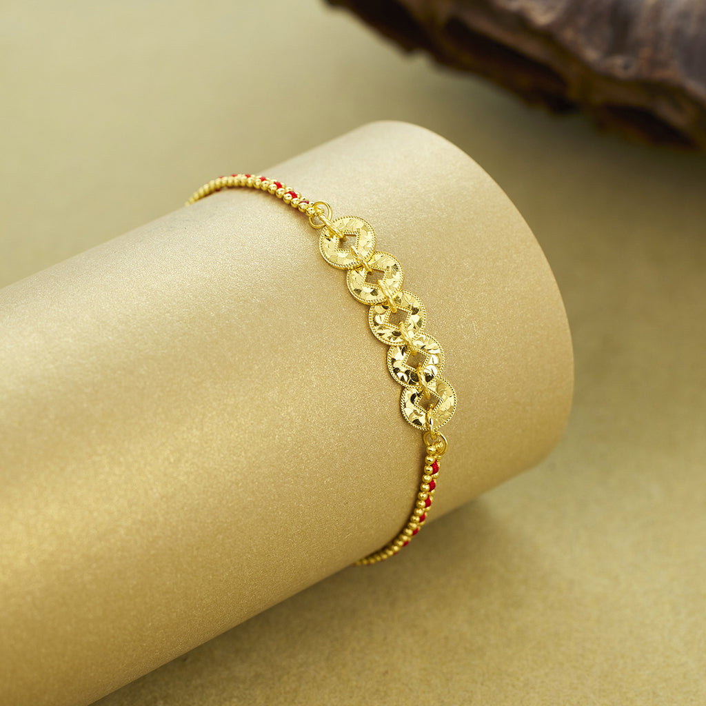 Damen kunstvolles Armband mit goldenem Münzdesign und roten Akzentperlen Shop Nory