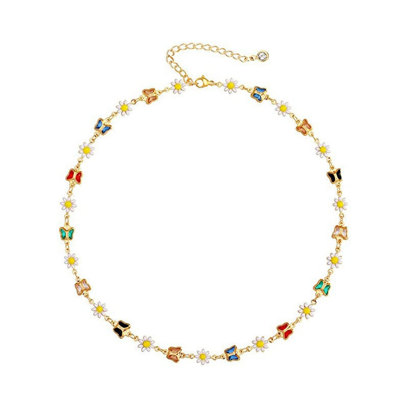 Damen Halskette mit verspielten Schmetterlings- und Gänseblümchen-Elementen Shop Nory