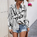 Damen elegante Bluse mit modernem grafischen Muster und tiefem Rundhalsausschnitt