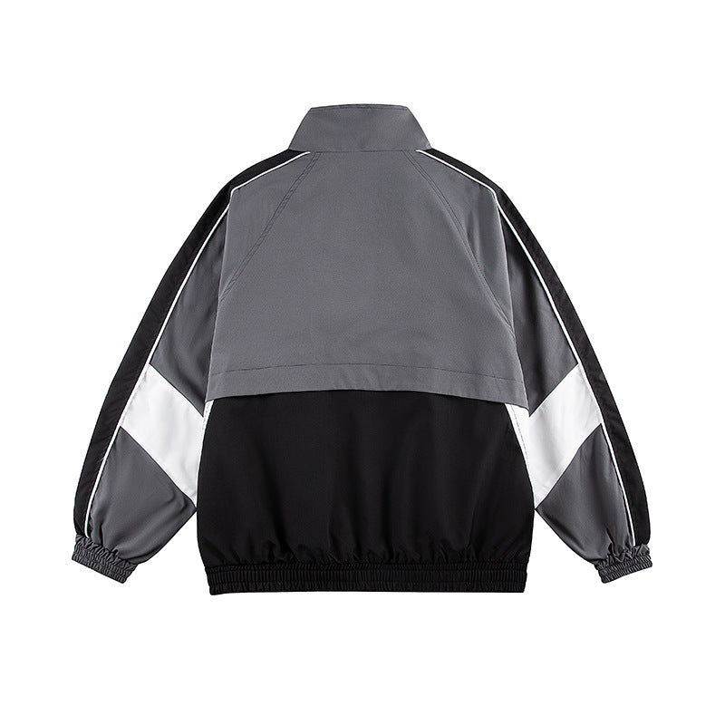 Unisex Kastig geschnittene Trackjacke im Retro-Sportstil mit hohem Stehkragen, Farbblock‑Einsätzen und elastischem Saum Shop Nory