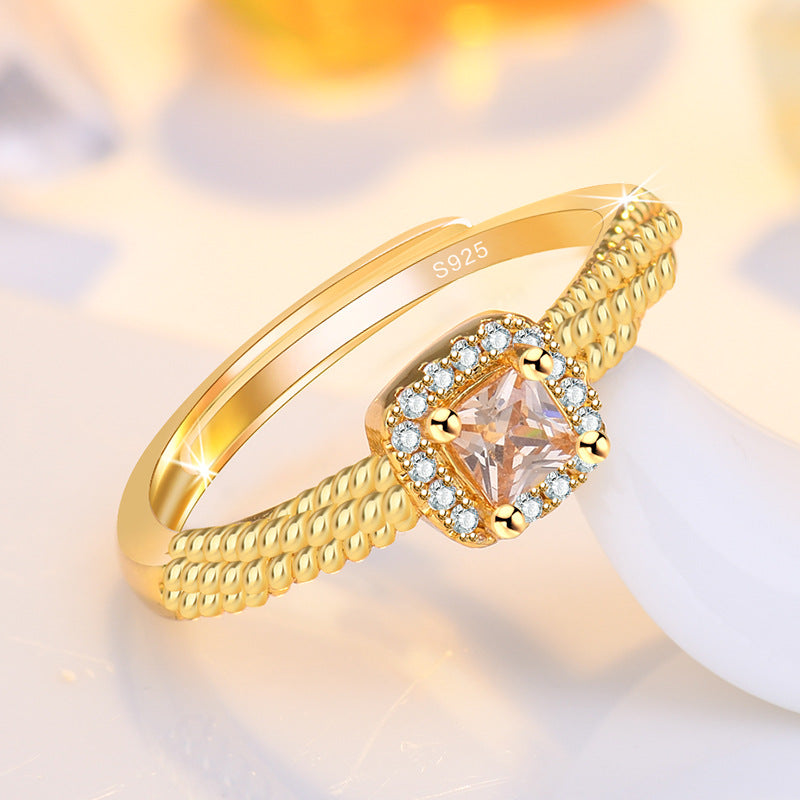 Damenring mit kunstvollem Zirkonia-Besatz und elegantem Golddesign Shop Nory