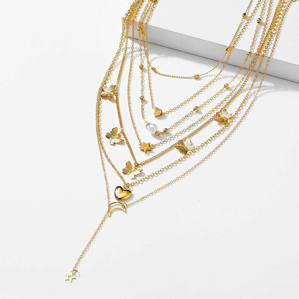 Damen Schmuckset mit mehrlagigen Ketten und vielfältigen Ringen Shop Nory