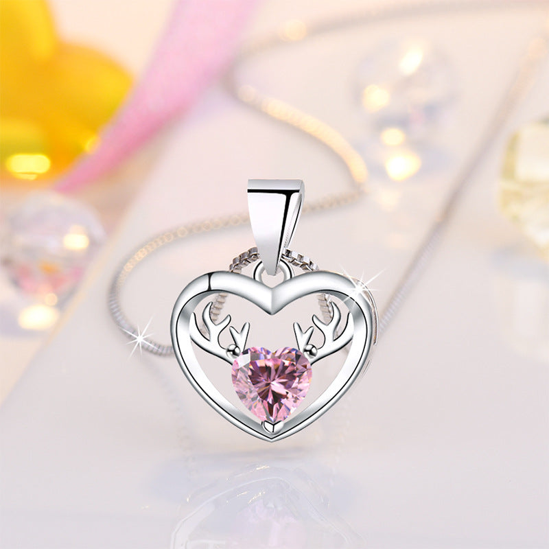 Damen Halskette mit herzförmigem Anhänger und eleganten Hirschakzenten Shop Nory