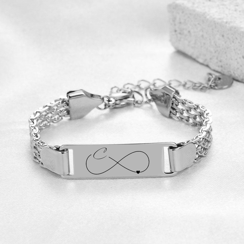Damen Armband mit personalisierbarem Infinity-Anhänger und feinem Edelstahlband Shop Nory