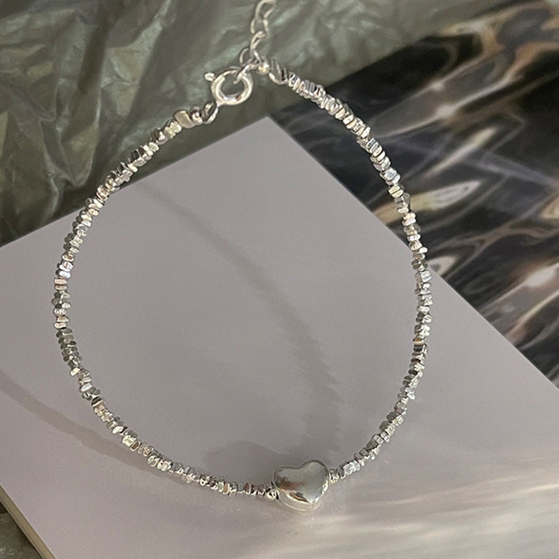 Damen Armkette mit zeitlosem Herzmotiv und funkelnden Elementen Shop Nory