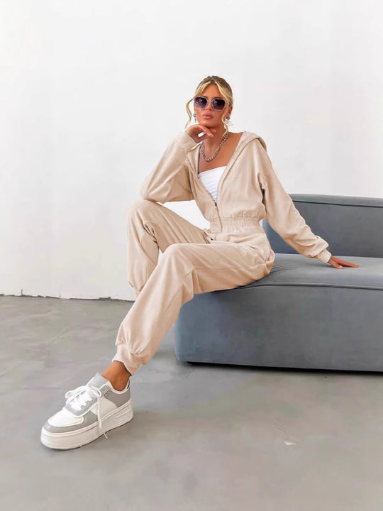 Damen Velours Jumpsuit mit Kapuze, Reißverschluss und tailliertem Gummibund Shop Nory