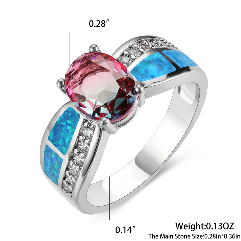 Damen Ring mit kunstvollem Opalanhänger und funkelnden Zirkonia-Details Shop Nory