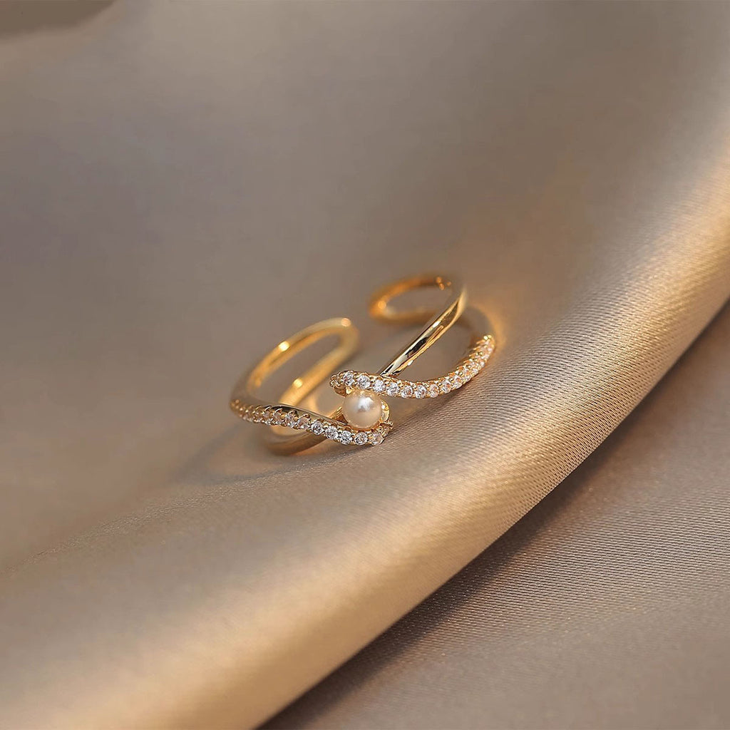 Damen eleganter Spiralring mit zeitlosen Perlen- und Zirkonia-Akzenten Shop Nory