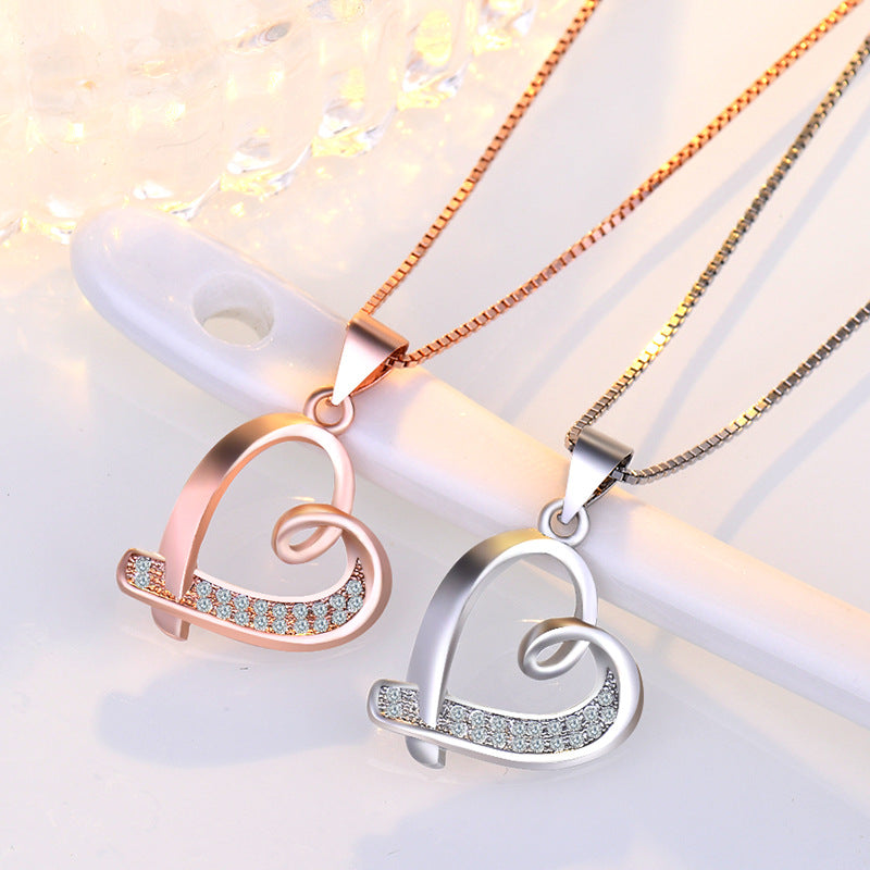 Damen Halskette mit elegantem Herzanhänger und funkelnden Zirkonia Shop Nory