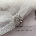 Damenring mit elegantem geschwungenen Design und funkelnden Zirkonia Shop Nory
