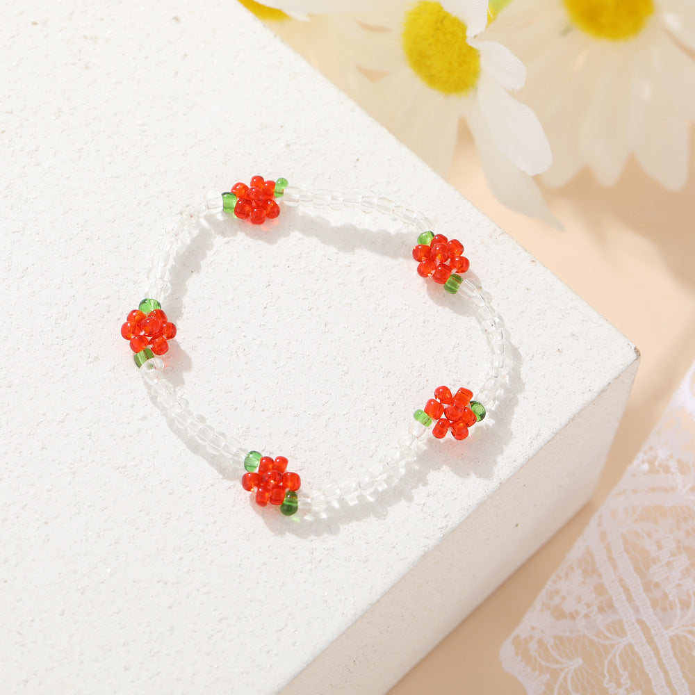 Damen modisches und verspieltes Perlenarmband mit floralem Akzent Shop Nory