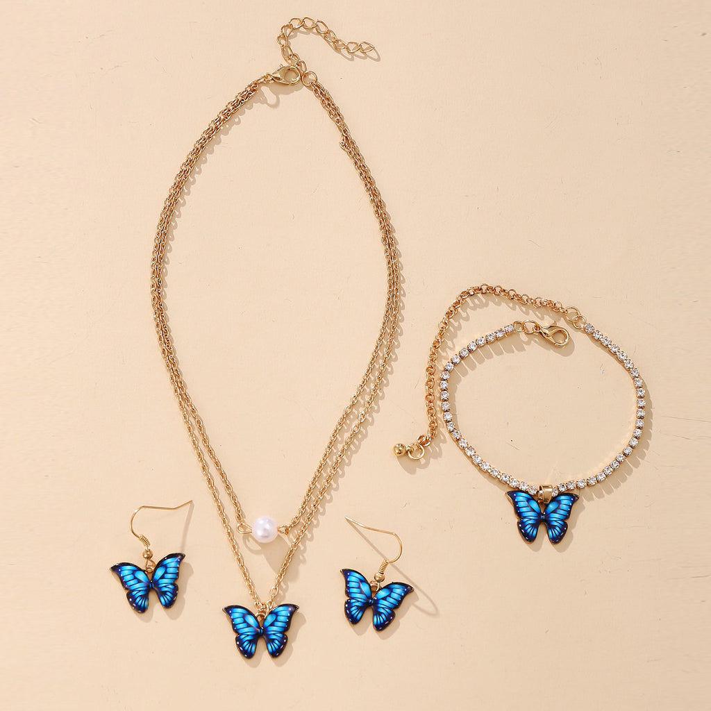 Damen Schmuckset mit schimmernden Schmetterlingsanhängern und funkelnden Elementen Shop Nory