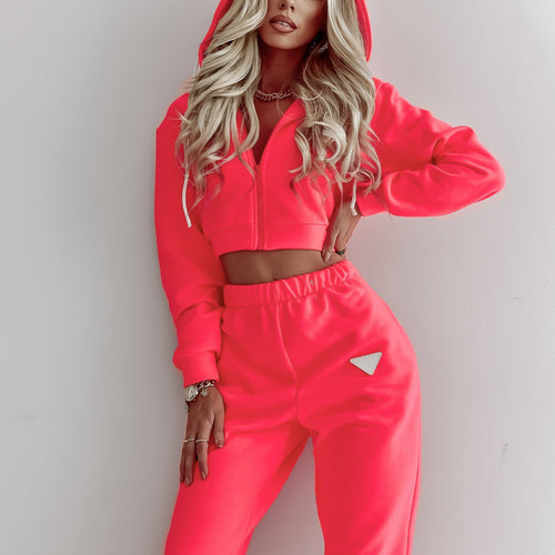 Damen kurzes Kapuzen-Sweatshirt mit Reißverschluss und hochgeschnittene Jogginghose Set Shop Nory
