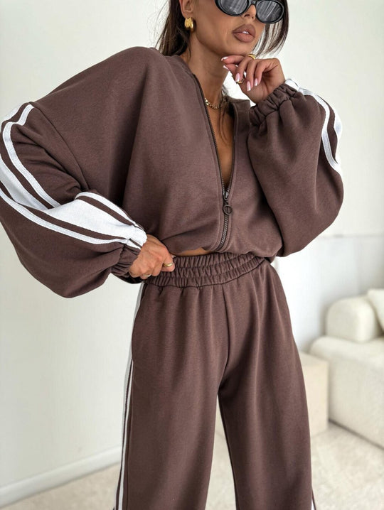 Damen cropped Zip-Hoodie mit voluminösen Ballonärmeln und High-Waist Relaxhose im sportlichen Seitenstreifen-Design Shop Nory
