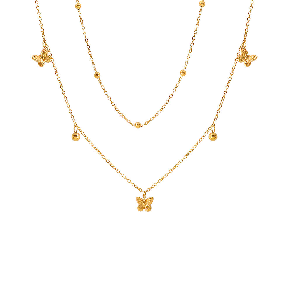 Damen mehrlagige Halskette mit filigranen Schmetterlings- und Kugeldetails Shop Nory