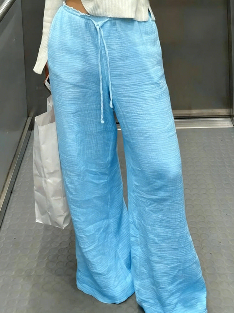 Damen Leinenhose mit lockerer, knöchellanger Passform, seitlichen Eingrifftaschen und Zierknopf-Details Shop Nory