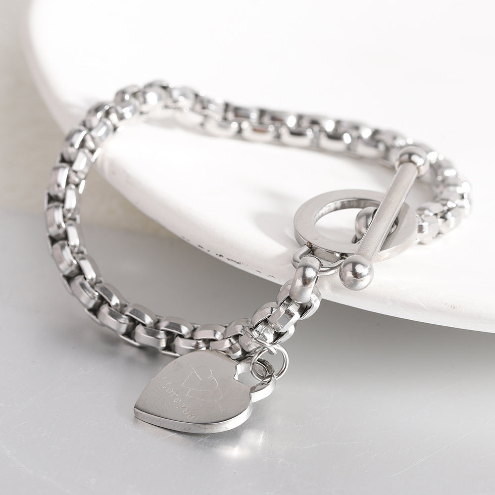 Damen Armband mit herzförmigem Anhänger und doppeltem Edelstahl-Design Shop Nory