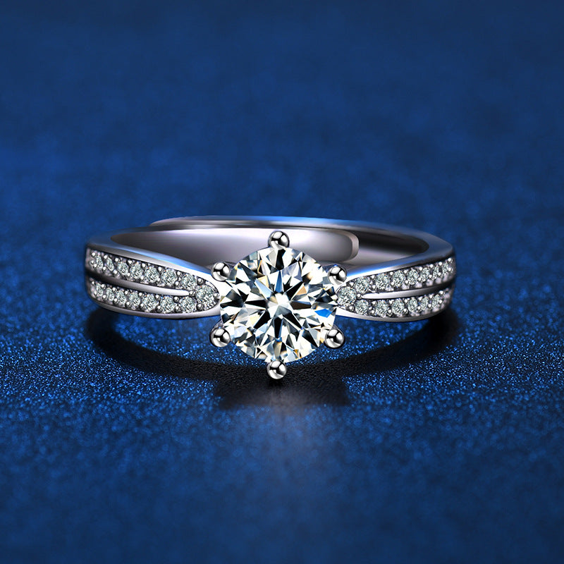 Damenring mit funkelndem Hauptstein und eleganter Zirkonia-Verzierung Shop Nory