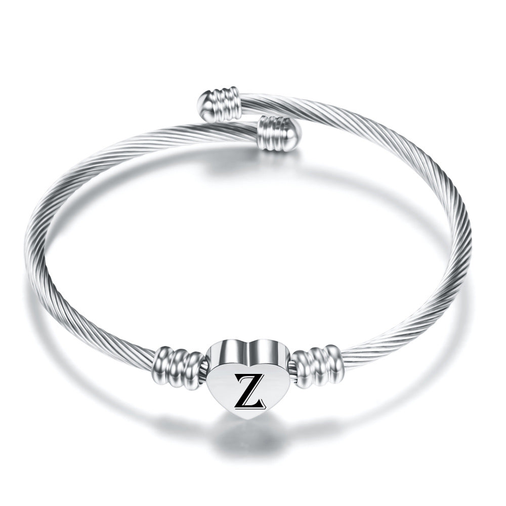 Damen Armreif mit herzförmigem Anhänger und eleganten Akzenten Shop Nory