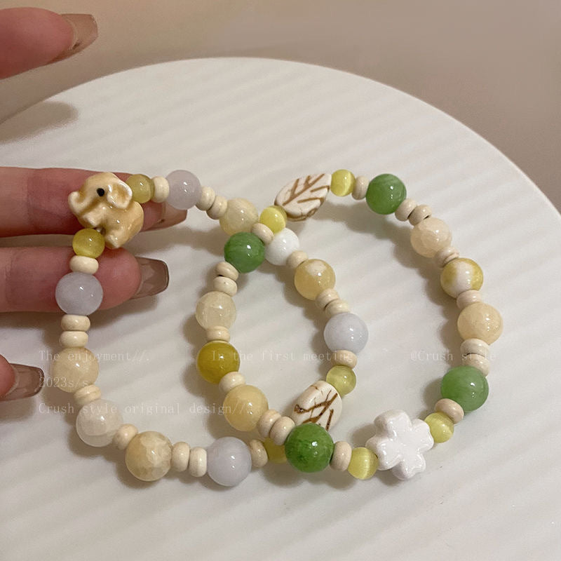 Damen Armband aus handgefertigten Natursteinen mit charmanten Tiermotiven Shop Nory
