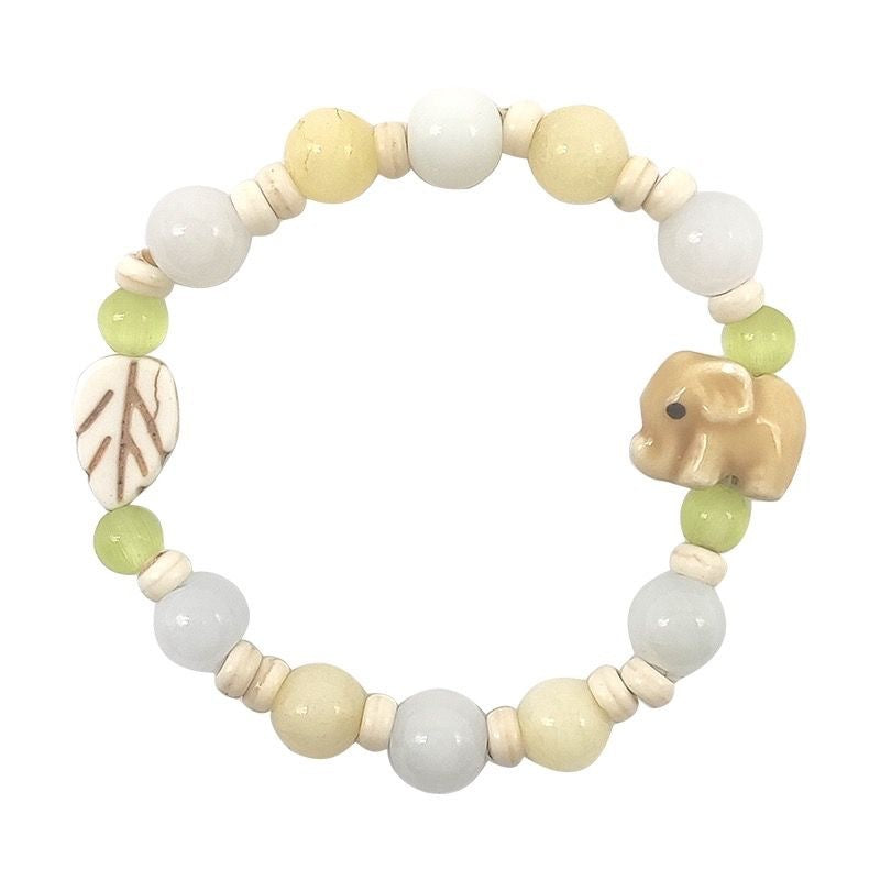 Damen Armband aus handgefertigten Natursteinen mit charmanten Tiermotiven Shop Nory