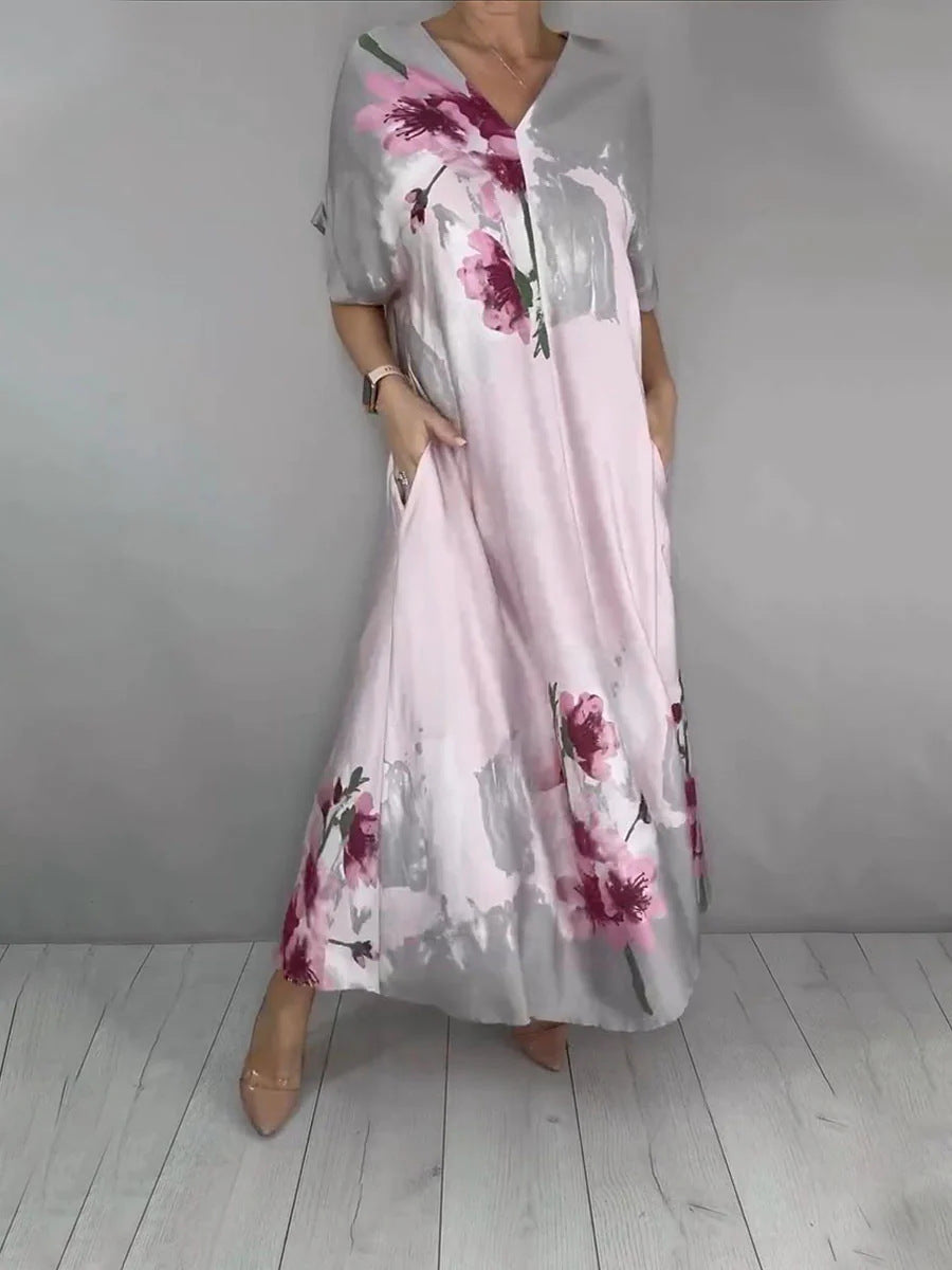 Damen Maxikleid mit weitem Fall, V-Ausschnitt, Eingrifftaschen und floraler Aquarelloptik Shop Nory