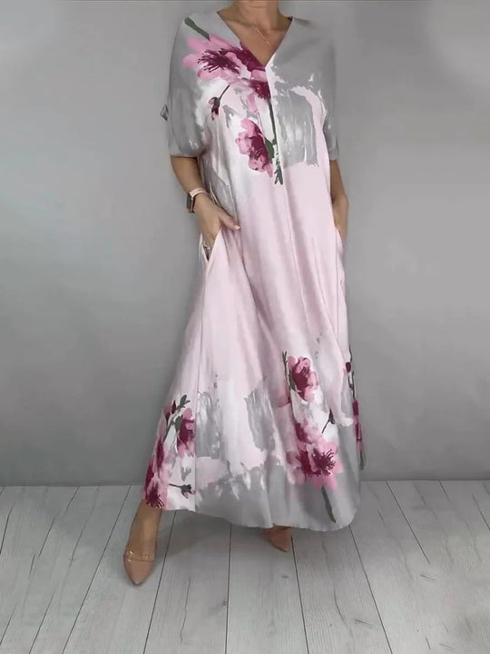 Damen Maxikleid mit weitem Fall, V-Ausschnitt, Eingrifftaschen und floraler Aquarelloptik Shop Nory