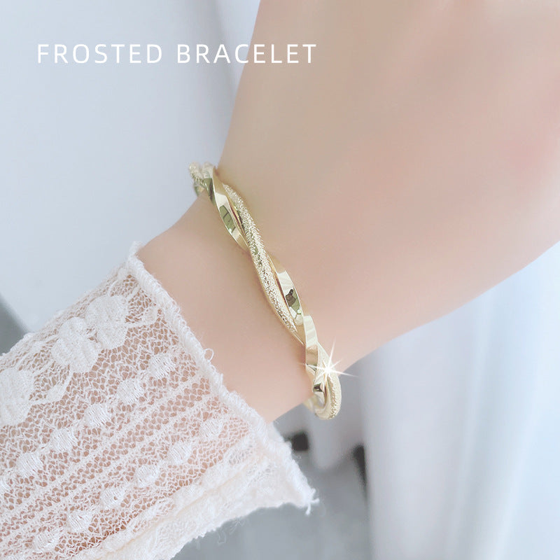 Damen eleganter Armreif mit kunstvoller Drehung und funkelndem Zirkonia Shop Nory