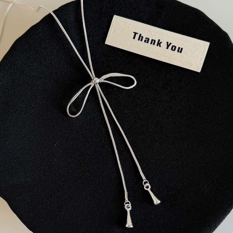 Damen Kette mit elegantem Schleifenanhänger aus hochwertigem Metall Shop Nory