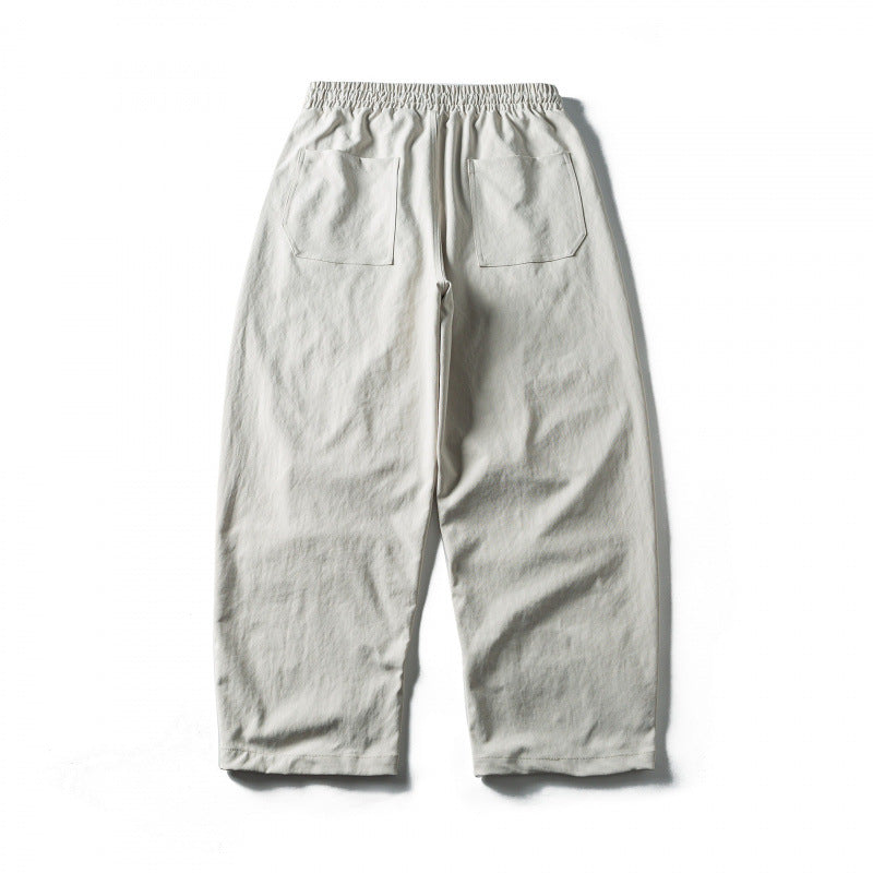 Unisex Weite Cropped-Hose mit Tunnelzug, elastischem Bund und markanten Nahtpaneelen Shop Nory