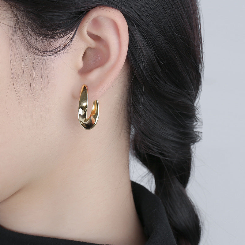 Damen Ohrringe mit modernem geschwungenem Design und hochwertiger Edelstahlverarbeitung Shop Nory