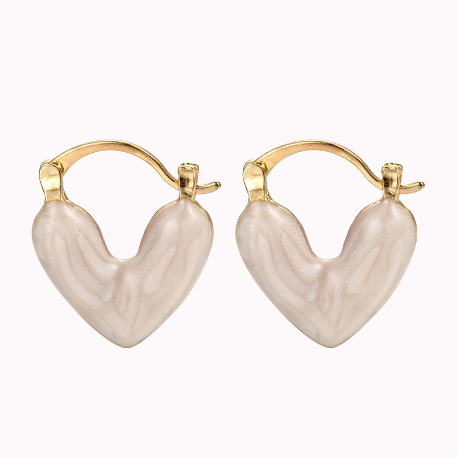 Damen Ohrstecker in Herzform mit elegantem Goldrahmen Shop Nory