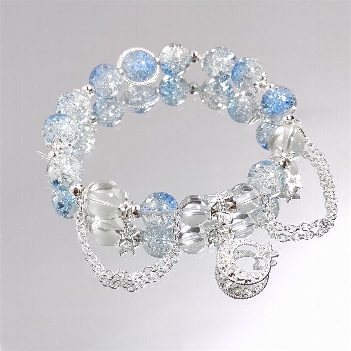 Damen Armband mit funkelnden Kristall-Elementen und charmanten Anhängern Shop Nory
