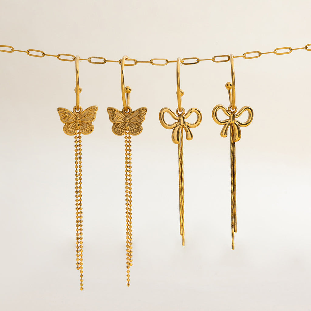 Damen Ohrhänger mit filigranem Schmetterlingsdesign und hängenden Kettendetails Shop Nory