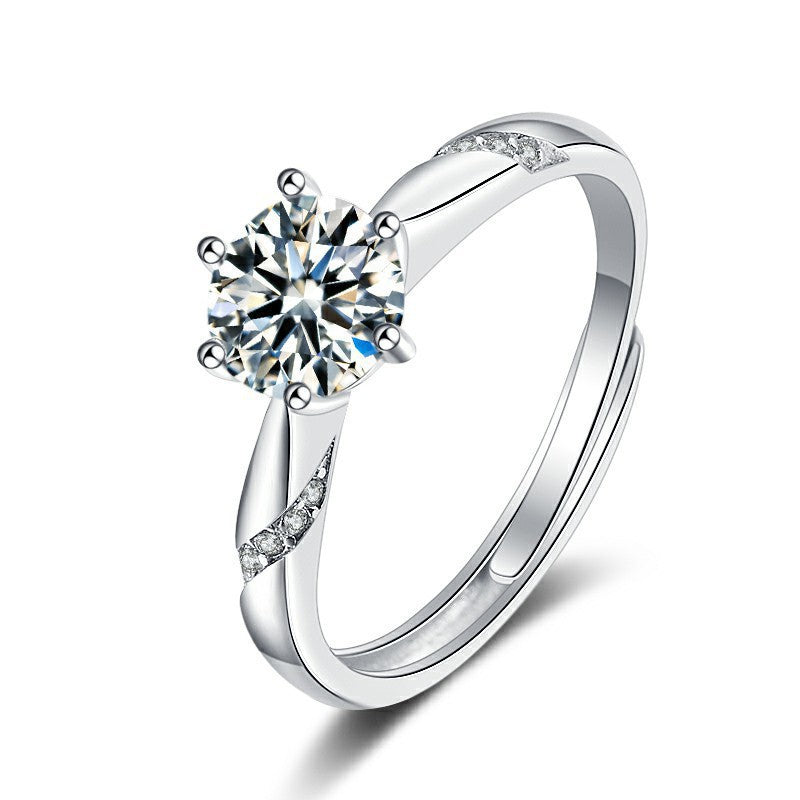 Damen verführerischer Ring mit funkelndem Zentrum und zarten Zirkonia-Details Shop Nory