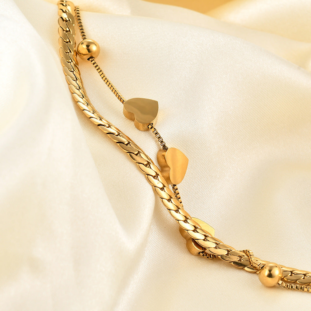 Damen Armband mit elegantem Herzdesign und feinen Kettengliedern Shop Nory