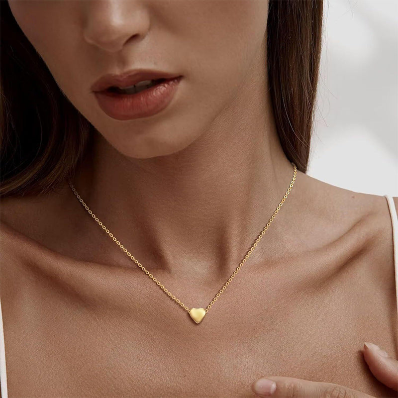 Damen Halskette mit doppellagigem Design und zarten Herz- und Schleifenanhängern Shop Nory
