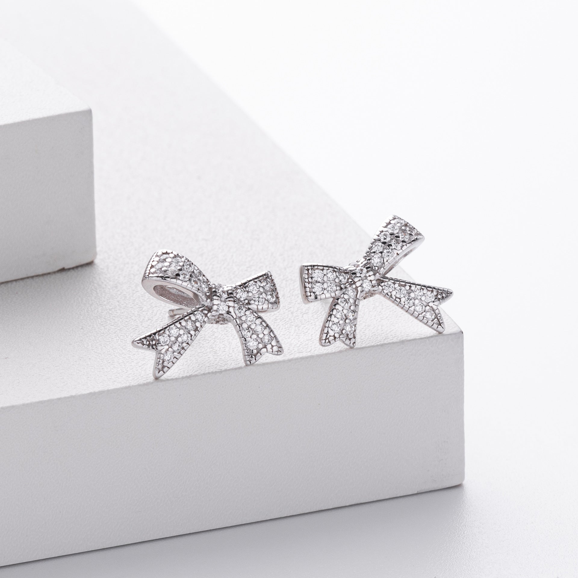 Damen Ohrringe im Schleifen-Design aus 925 Sterling Silber mit Zirkonia Shop Nory
